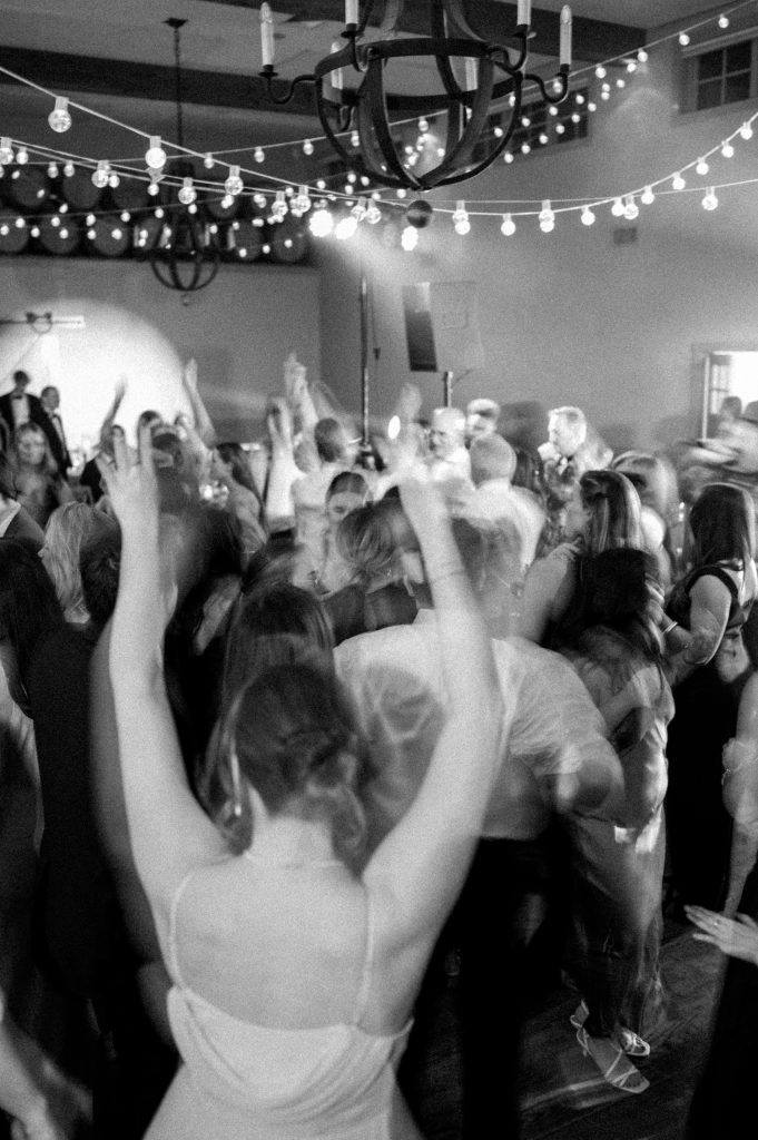 Friends and family dancing together during the fun-filled after-party at the vineyard.