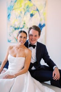 Claire and Jake sharing a quiet, romantic moment among the vineyard rows right after their first look, surrounded by golden autumn leaves at King Family Vineyards.