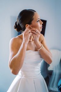 Claire getting ready on her wedding morning with hair and makeup by The Charlottesville Wedding Hair and Makeup Artist Team.